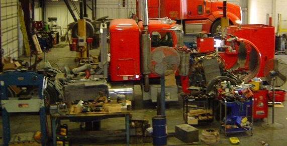 A picture of the inside of our repair facility with two truck tractors that we are working on