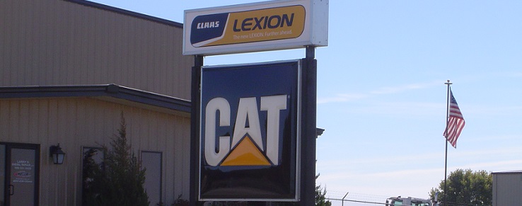 A picture of the our Claas Lexion Cat sign in front of our building